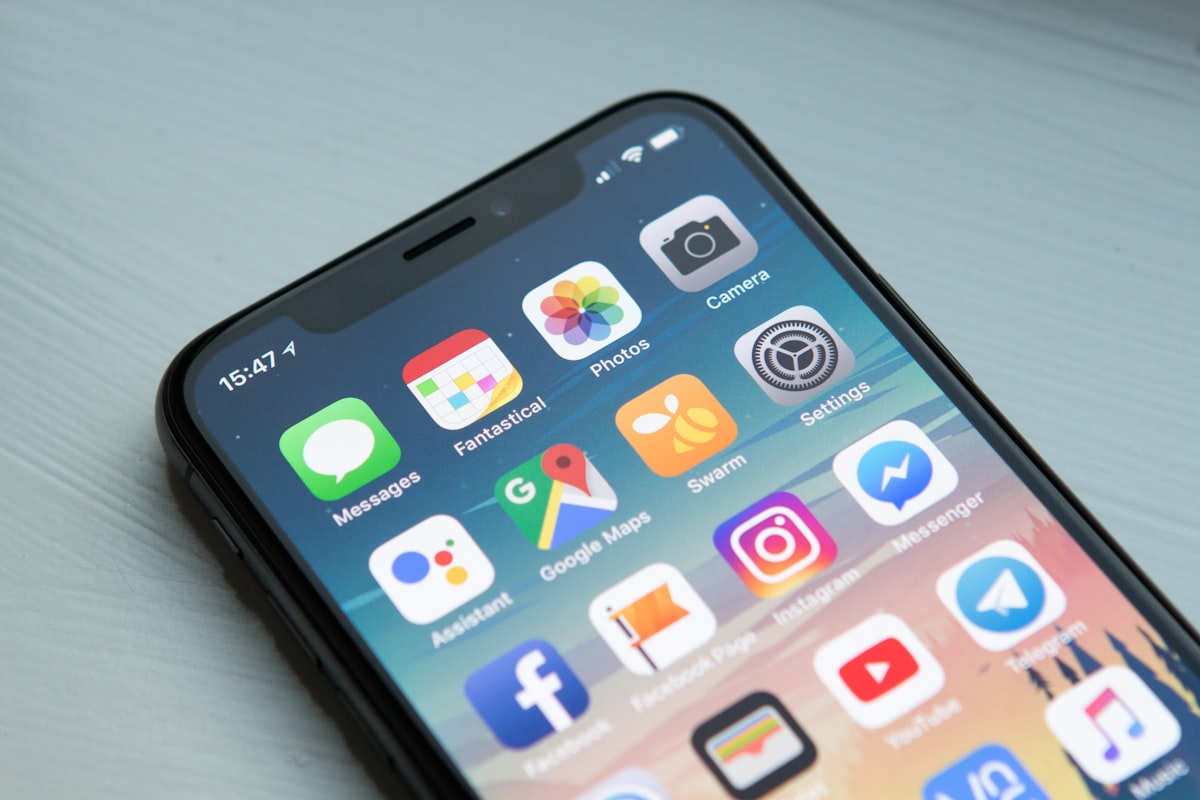 Mobile app development on smartphone and laptop